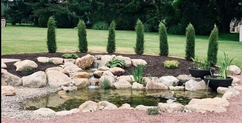 Ecosystem pond with waterfall and twin spillway bowls in the Lehigh Valley
